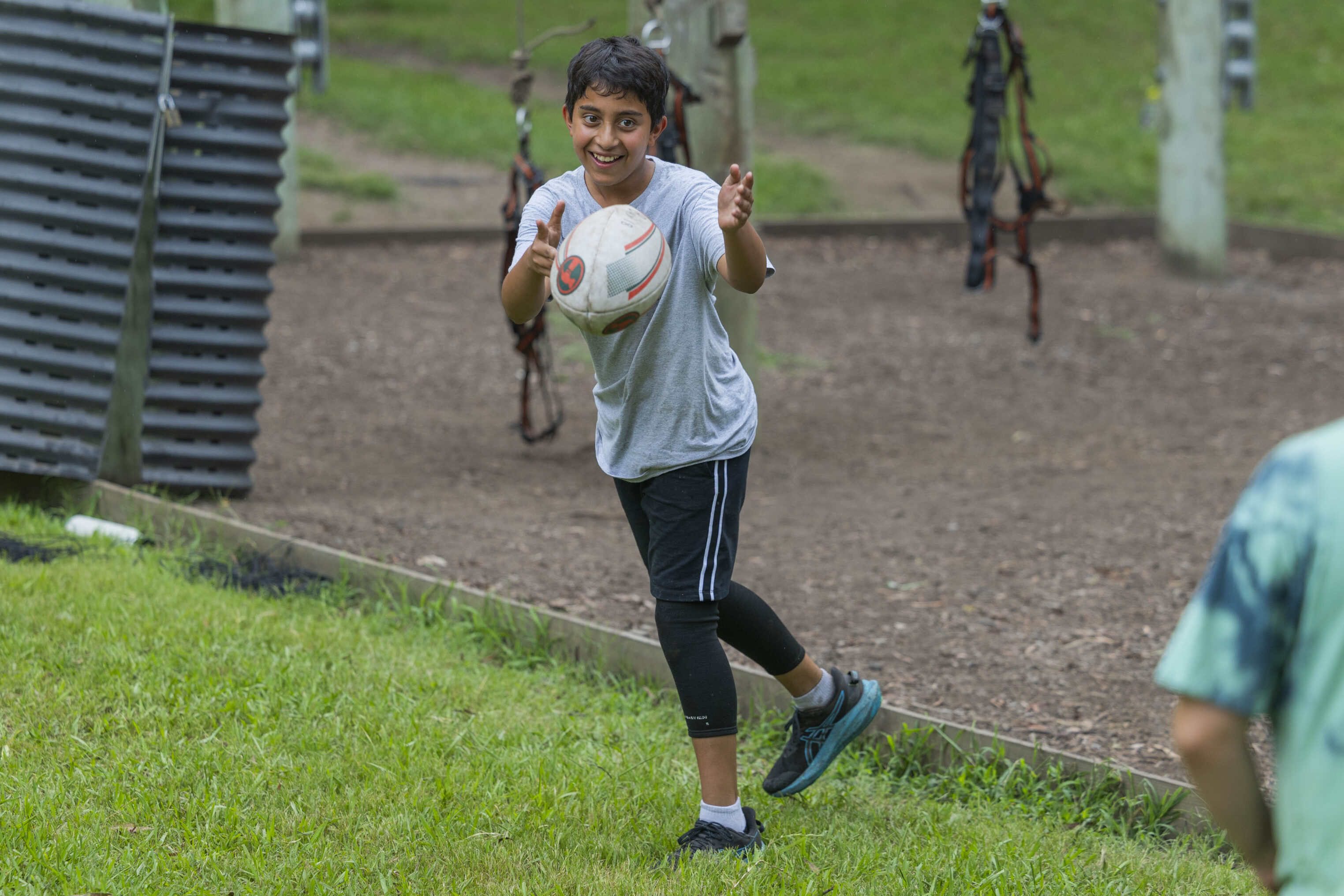 A boy holding a football.